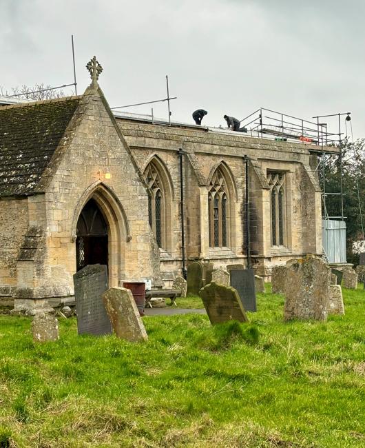 Threekingham Church repairs with men on the roof
