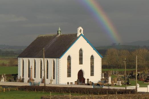 Killymurris Presbyterian Church, a white building, with a rainbow above
