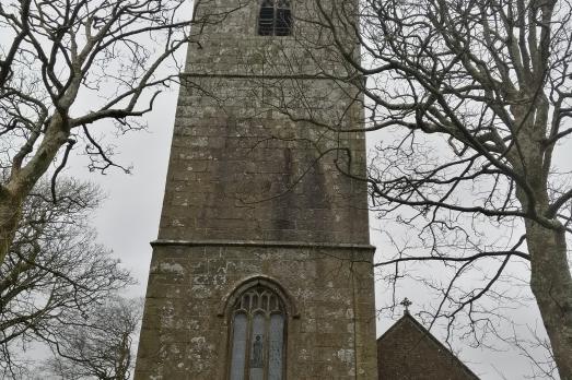 The tower at Bridgerule St Bridget Church, with trees either side