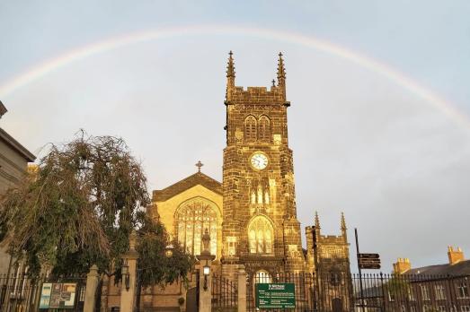 A rainbow over the top of St Michael & All Angels Church