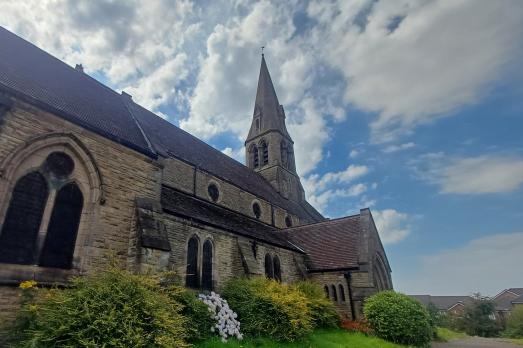 Church in front of a cloudy sky