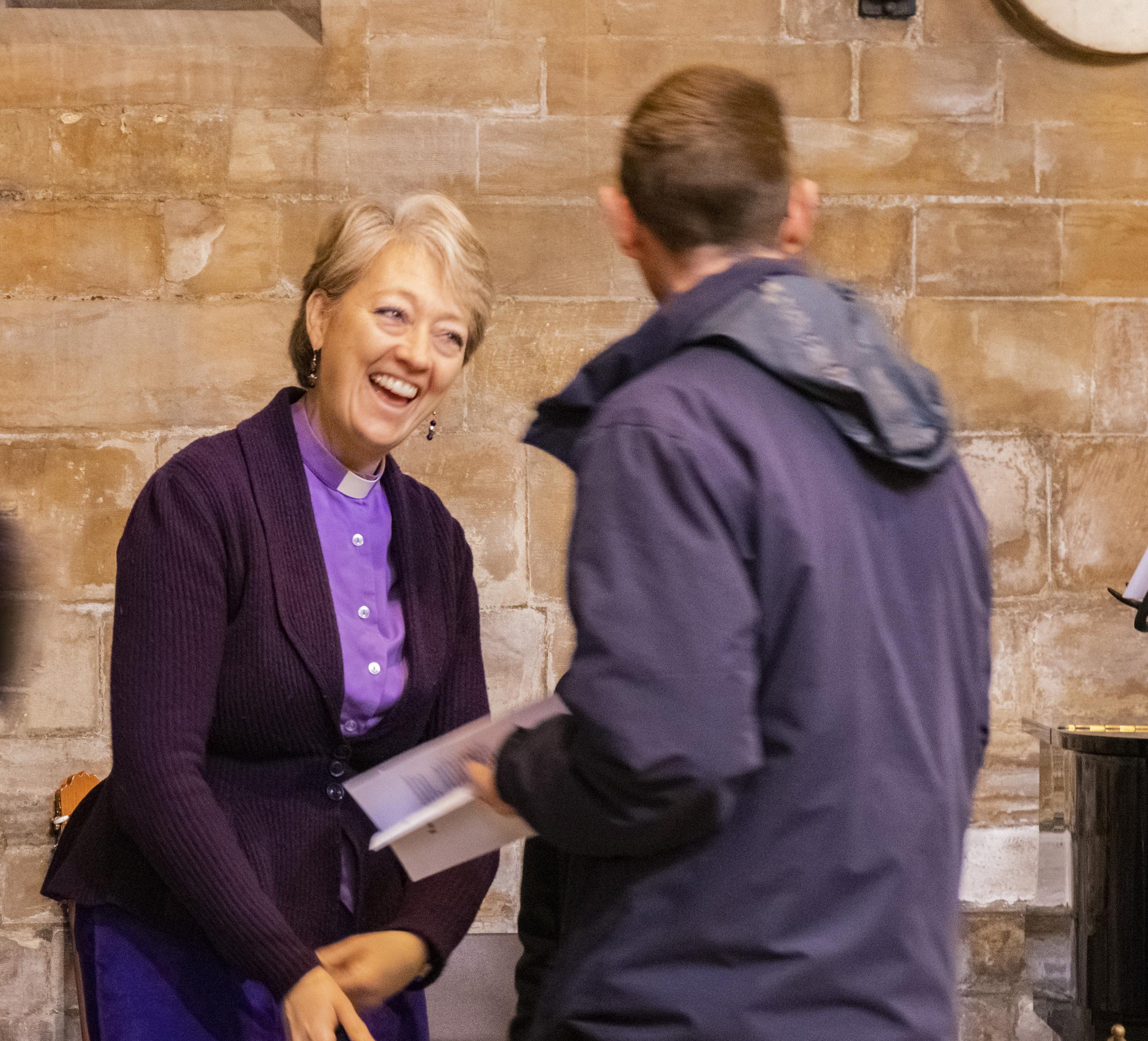 Clergy speaking to member of the public