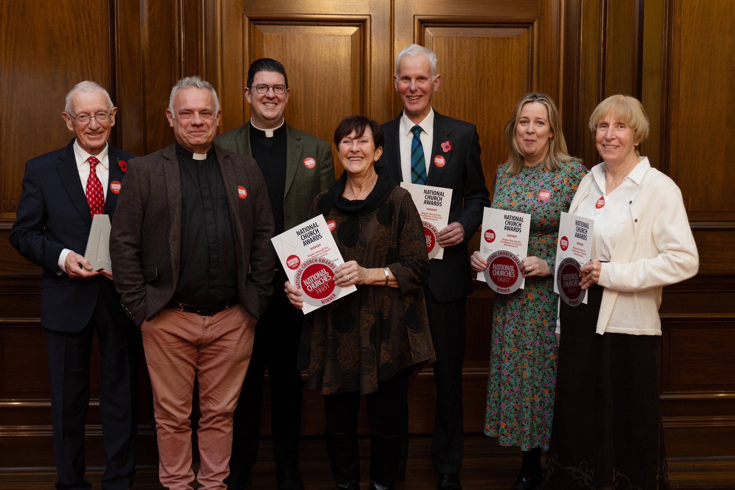 Image shows a group shot of the winners of the church maintenance awards