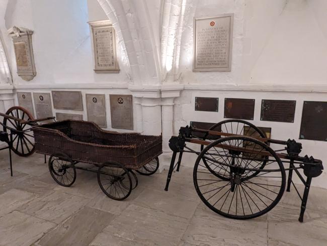 A wheeled stretcher inside a church