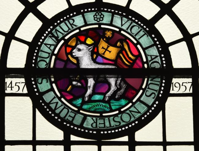 A lamb depicted in stained glass