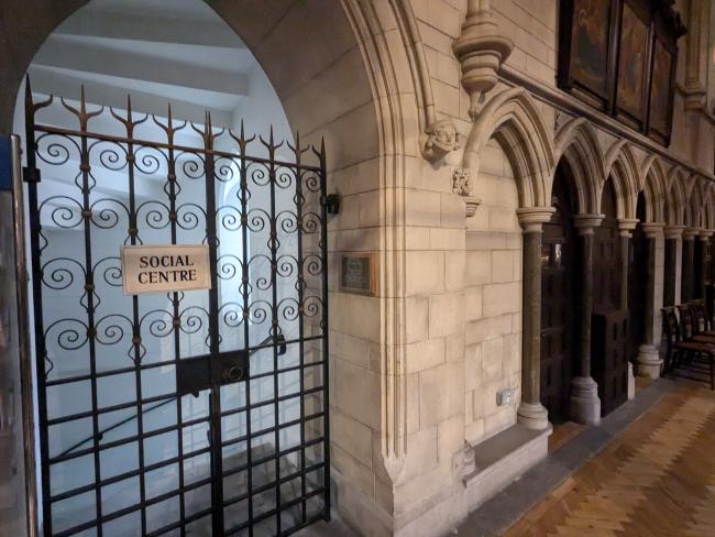 An image of a sign that reads 'social centre' inside a church