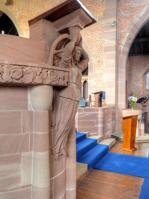 A pulpit with an angel carved into it at Long Street Methodist Church